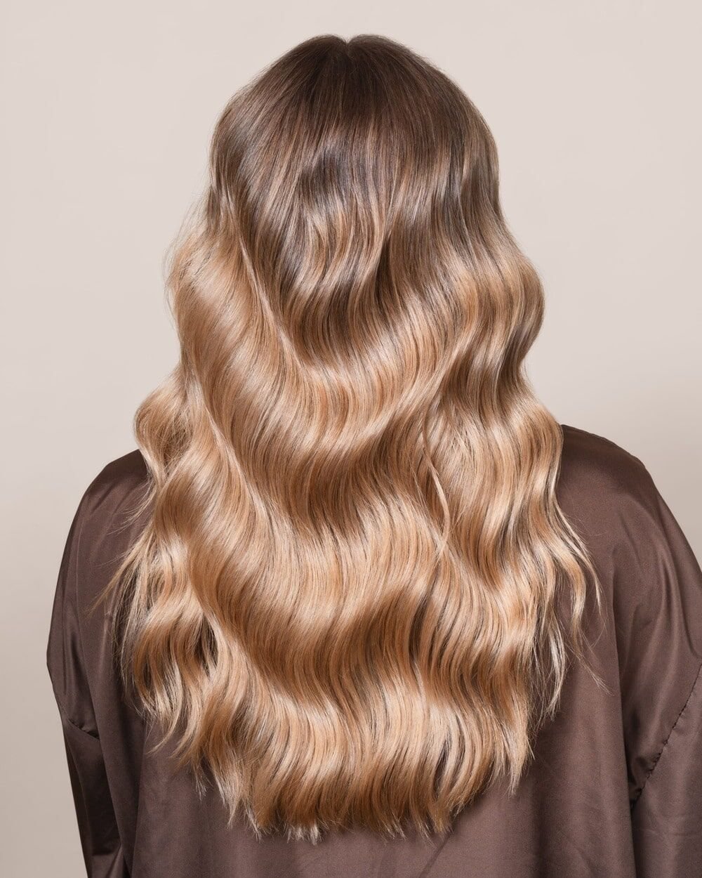 Long hair after treatment: smooth, glossy lengths with visible movement and shine